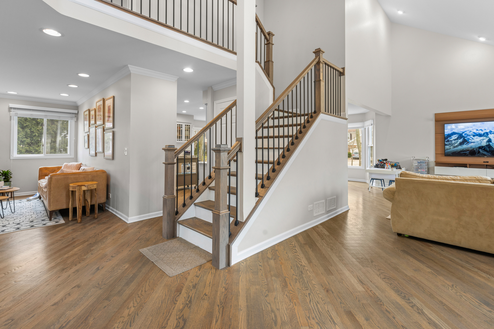 607 Raintree Road Buffalo Grove, IL 60089 - Photo 2 of 27 a living room with furniture and a dining table with wooden floor