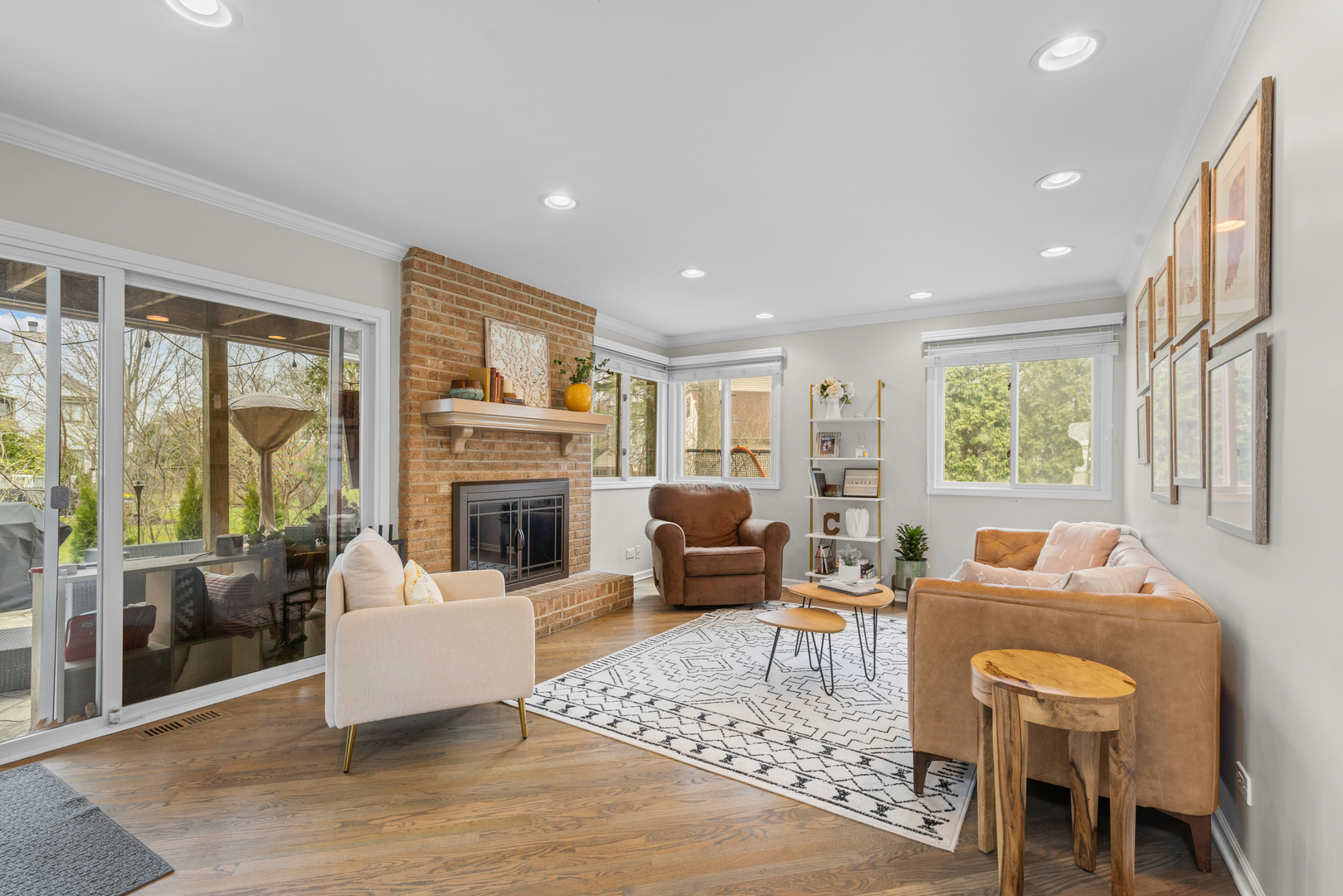 607 Raintree Road Buffalo Grove, IL 60089 - Photo 6 of 27 a living room with furniture a large window and a fireplace