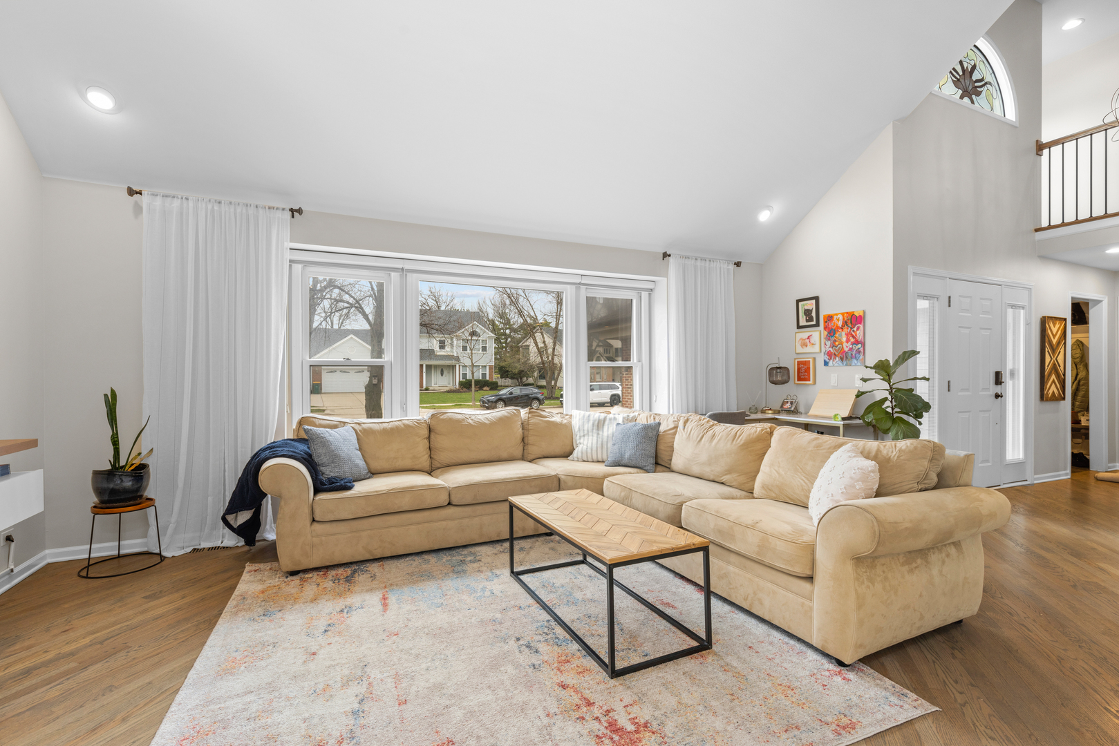 607 Raintree Road Buffalo Grove, IL 60089 - Photo 7 of 27 a living room with furniture and a large window