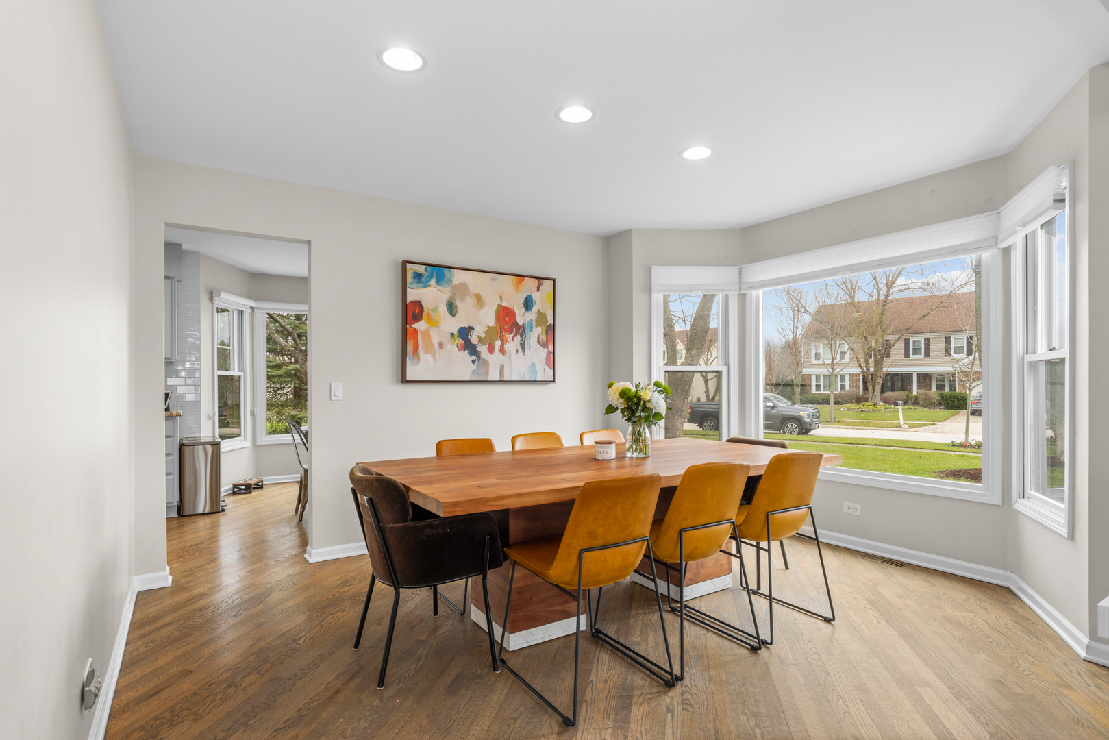 607 Raintree Road Buffalo Grove, IL 60089 - Photo 8 of 27 a dining room with furniture a large window and a table
