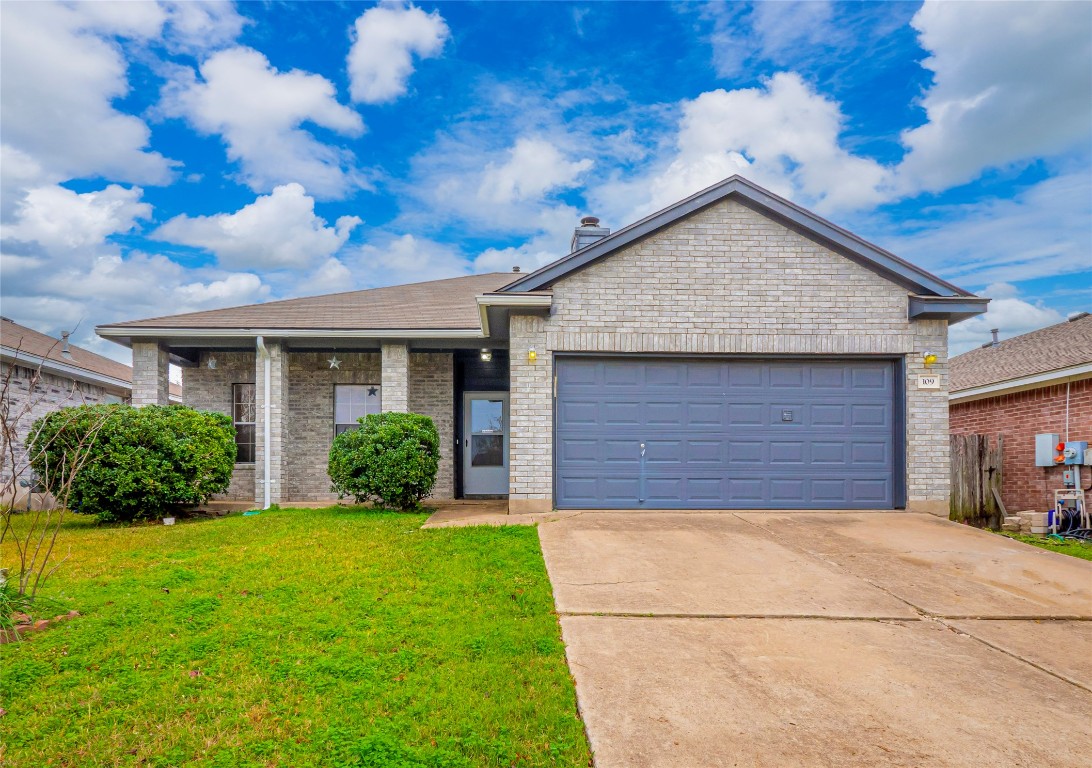 109 Cavalry Trail Elgin, TX 78621 - Photo 1 of 1 a front view of house with yard and green space