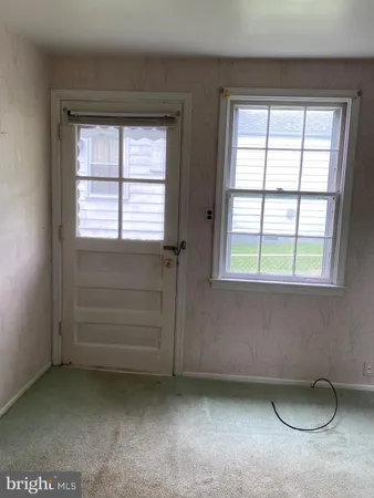 a view of a house with a yard and a garden