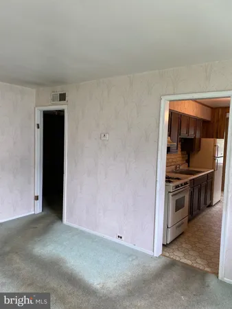 a kitchen with a stove and a refrigerator