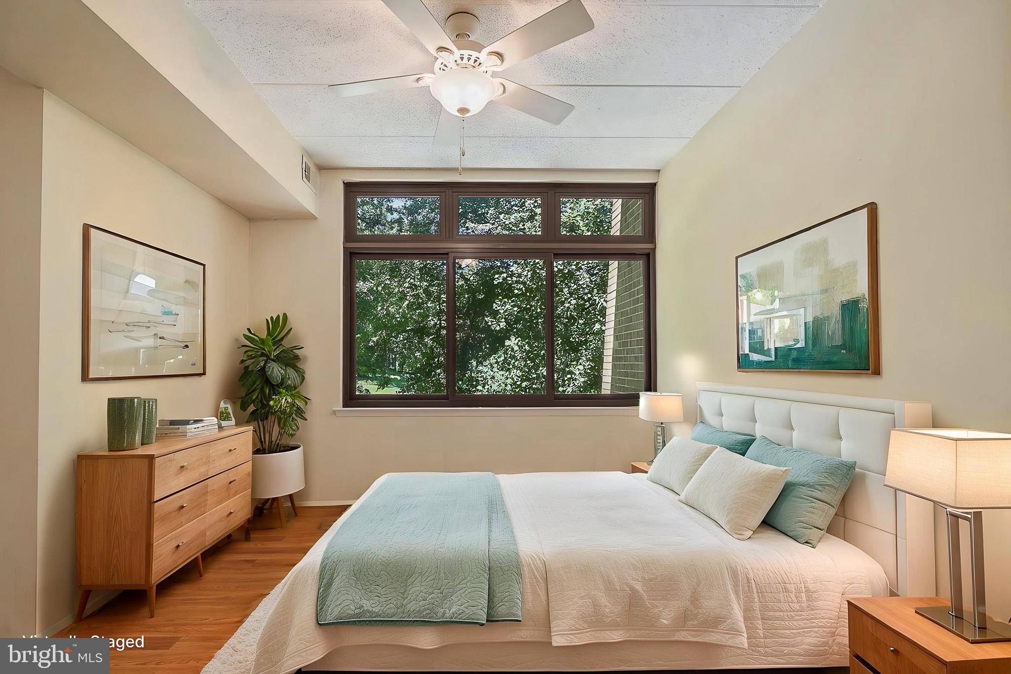 2116 Green Watch Way, Unit 10/201D Reston, VA 20191 - Photo 7 of 15 Serene bedroom with nature views.