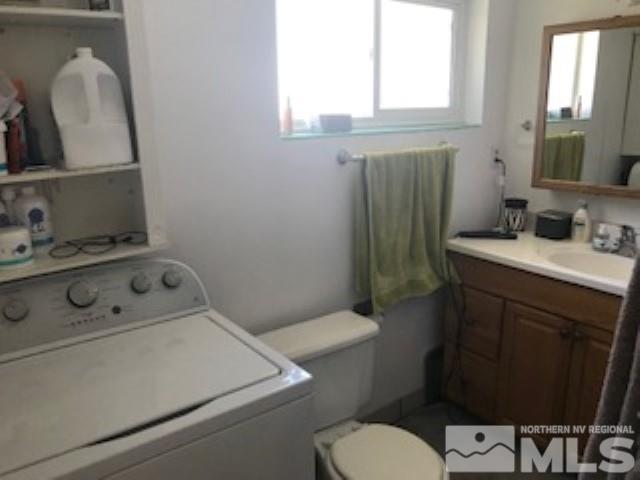 745-747 Apple Street Reno, NV 89502 - Photo 17 of 19 a bathroom with a sink toilet and mirror