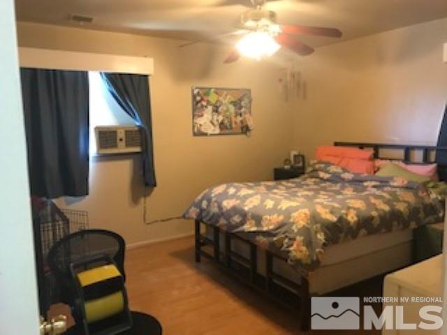 745-747 Apple Street Reno, NV 89502 - Photo 19 of 19 a bedroom with a bed and a chandelier