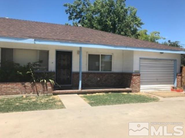 745-747 Apple Street Reno, NV 89502 - Photo 4 of 19 a view of a house with backyard and a yard