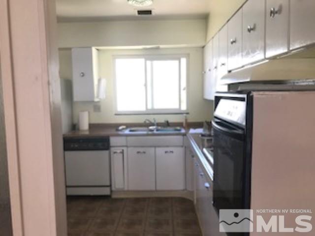 745-747 Apple Street Reno, NV 89502 - Photo 8 of 19 a bathroom with a sink a toilet and mirror