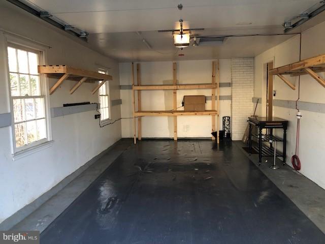 7911 Richfield Road Springfield, VA 22153 - Photo 36 of 40 Deep Garage Space w/ Built-In Storage Shelves