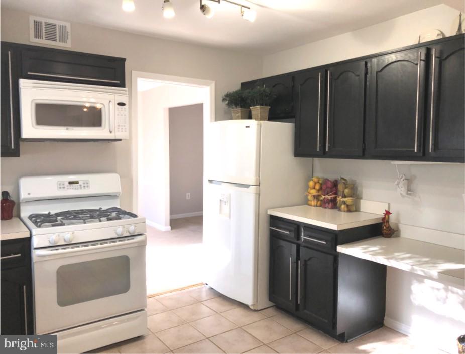 7911 Richfield Road Springfield, VA 22153 - Photo 8 of 40 Abundant Cabinetry with Kitchen Work Desk