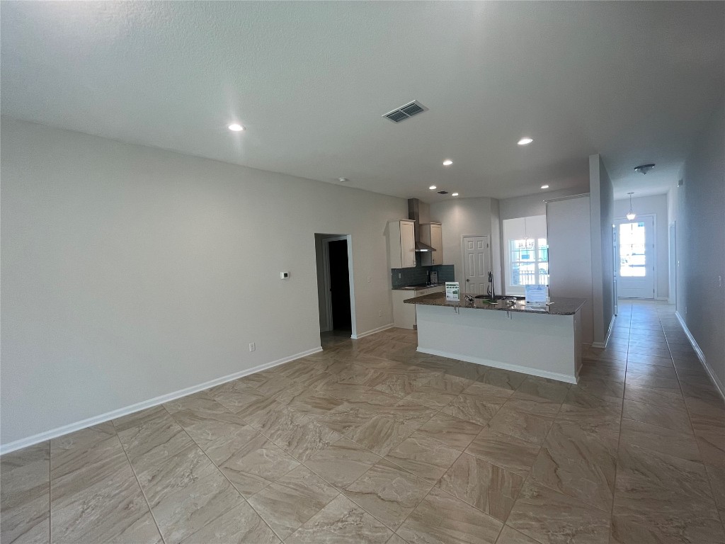 96754 Quartz Lane Yulee, FL 32097 - Photo 14 of 23 a view of a big room with kitchen and windows