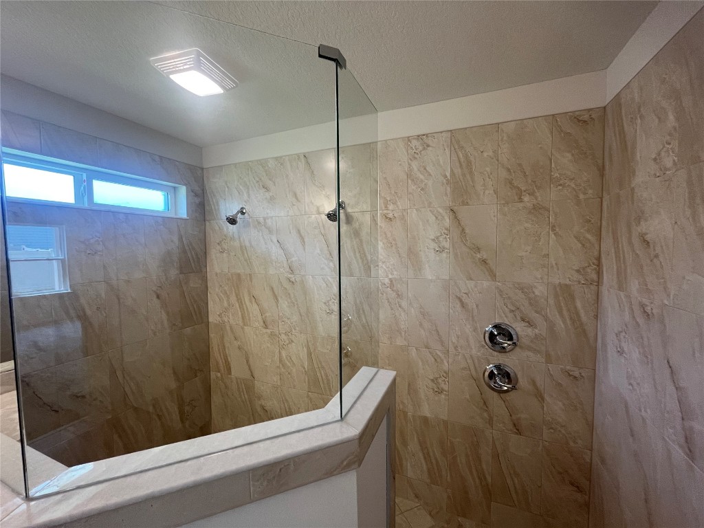 96754 Quartz Lane Yulee, FL 32097 - Photo 17 of 23 a bathroom with a shower and a sink