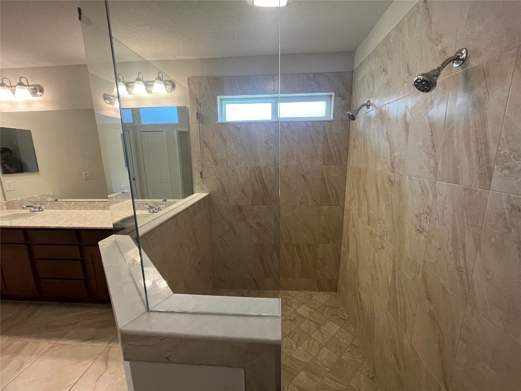 96754 Quartz Lane Yulee, FL 32097 - Photo 18 of 23 a bathroom with a sink a toilet and shower
