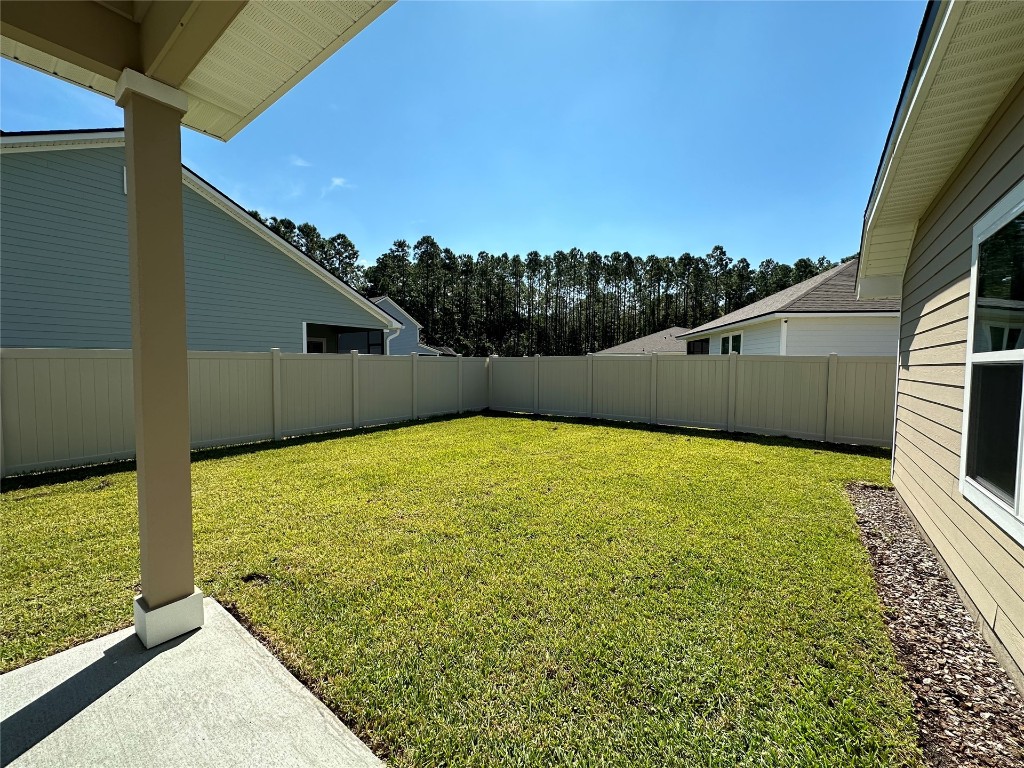 96754 Quartz Lane Yulee, FL 32097 - Photo 4 of 23 a view of back yard of the house
