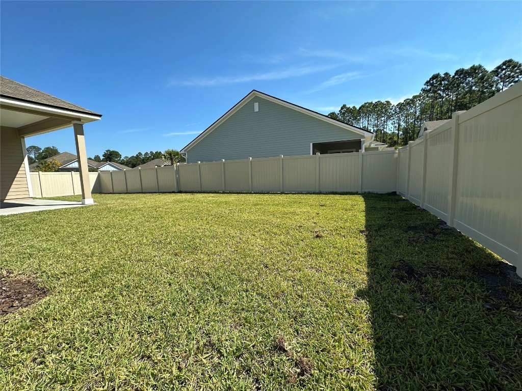 96754 Quartz Lane Yulee, FL 32097 - Photo 5 of 23 a view of a back yard