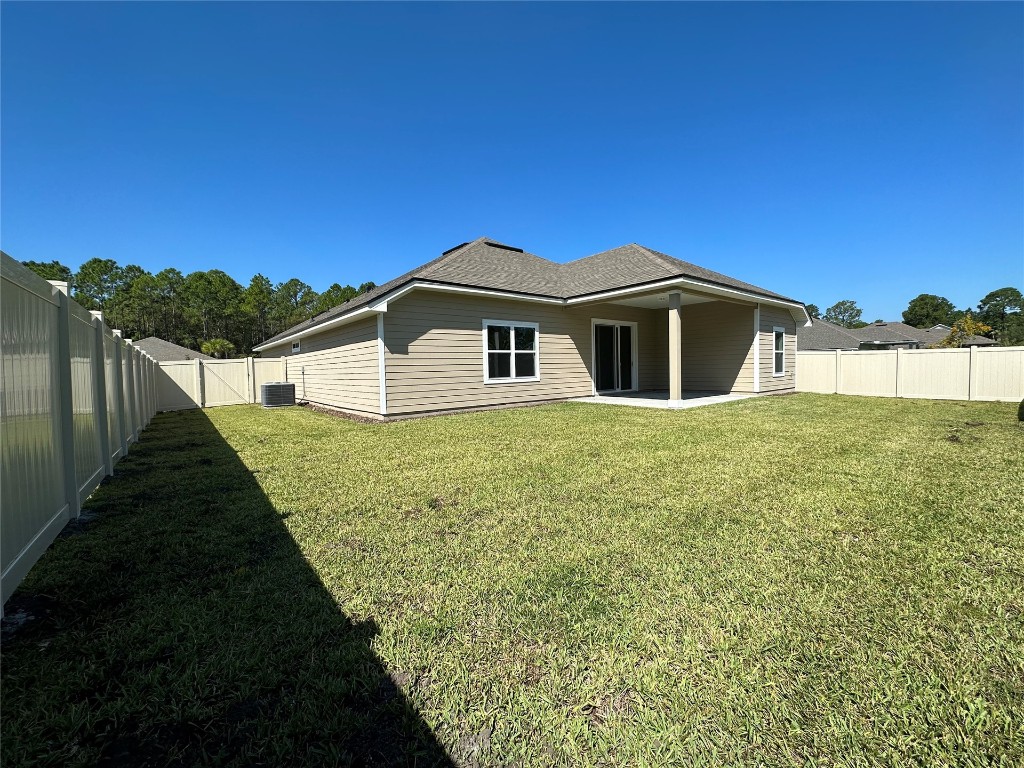 96754 Quartz Lane Yulee, FL 32097 - Photo 6 of 23 a view of a house with a yard