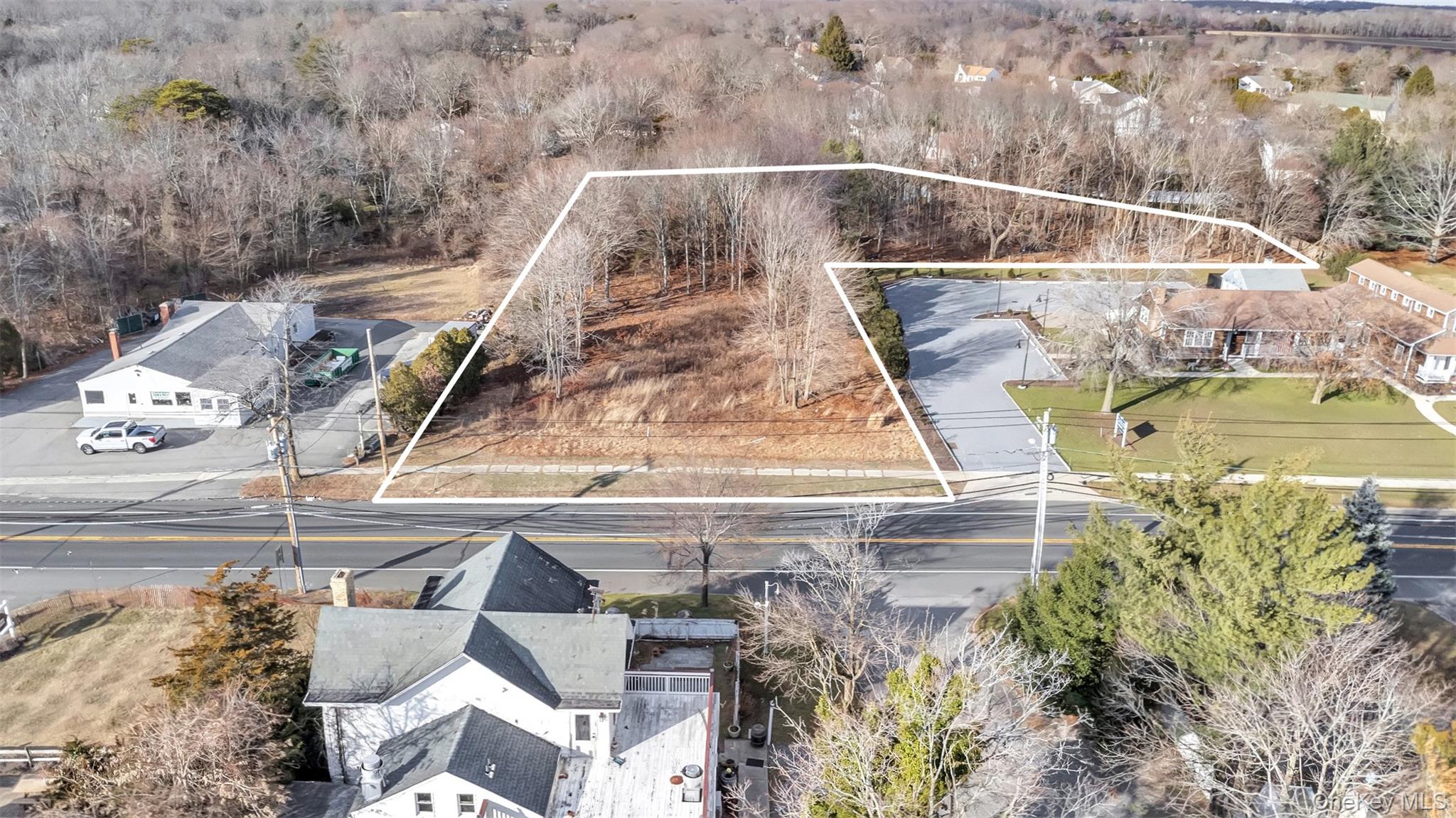 Undisclosed Address Aquebogue, NY 11931 - Photo 11 of 15 a view of swimming pool with a yard