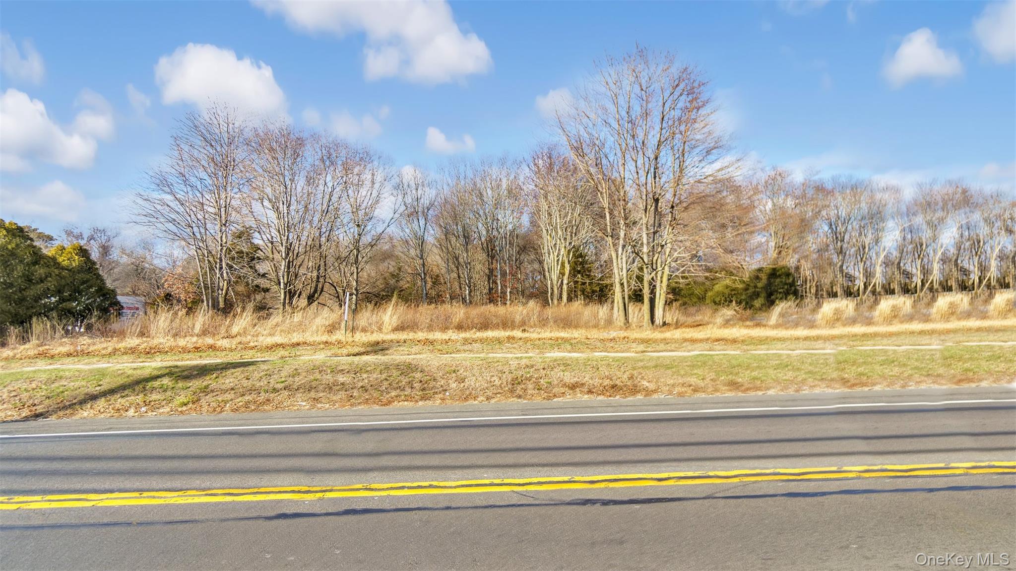 Undisclosed Address Aquebogue, NY 11931 - Photo 13 of 15 a view of swimming pool with an outdoor space and seating area