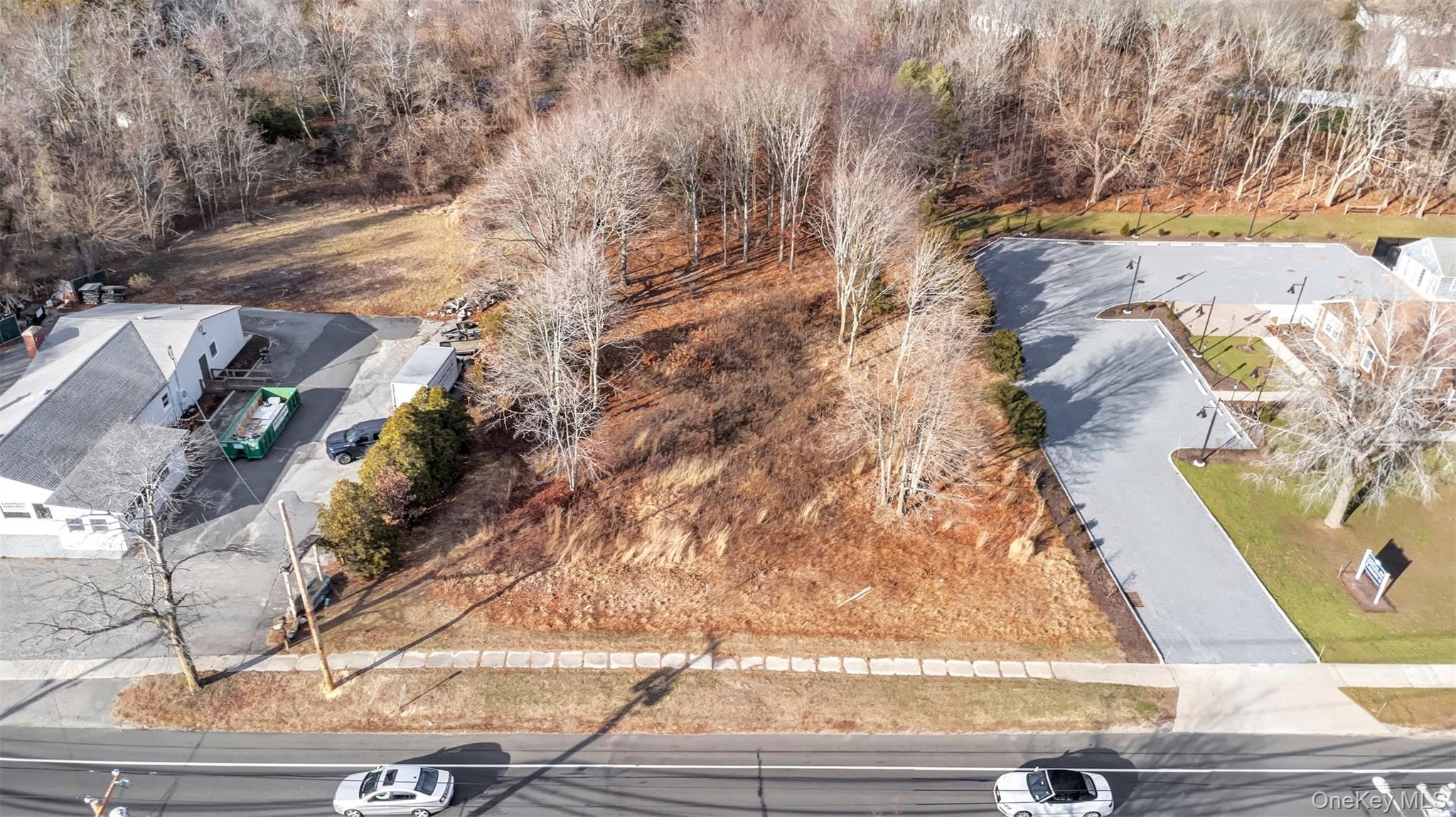 Undisclosed Address Aquebogue, NY 11931 - Photo 4 of 15 a view of entryway with wooden floor