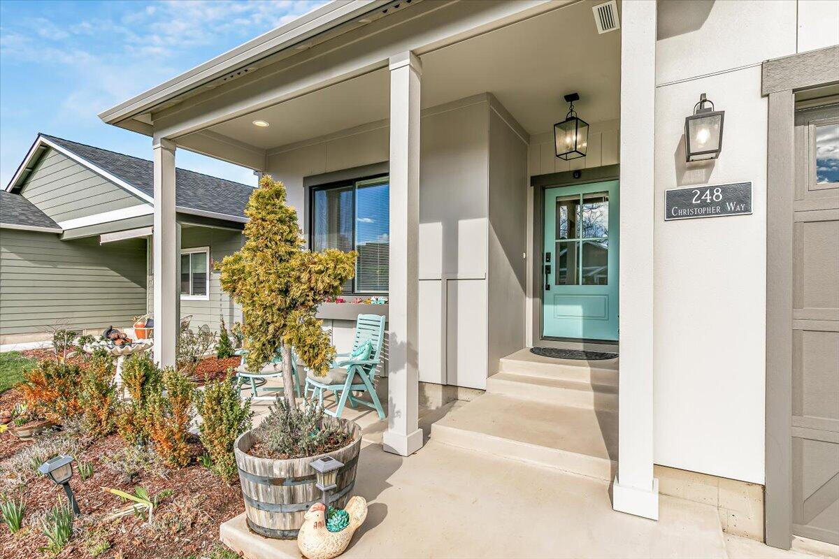 248 Christopher Way Talent, OR 97540 - Photo 2 of 33 a front view of a house with a potted plant
