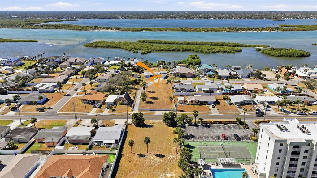 3816 Cardinal Boulevard Port Orange, FL 32127 - Photo 19 of 42 an aerial view of a city with lots of residential buildings ocean and mountain view