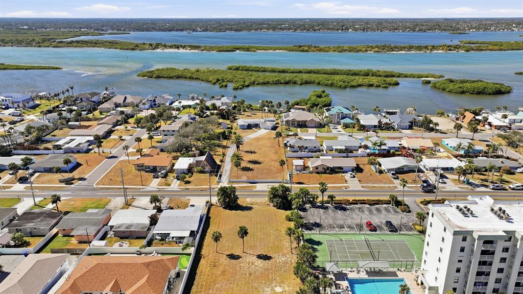 3816 Cardinal Boulevard Port Orange, FL 32127 - Photo 20 of 42 an aerial view of a city with lots of residential buildings ocean and mountain view