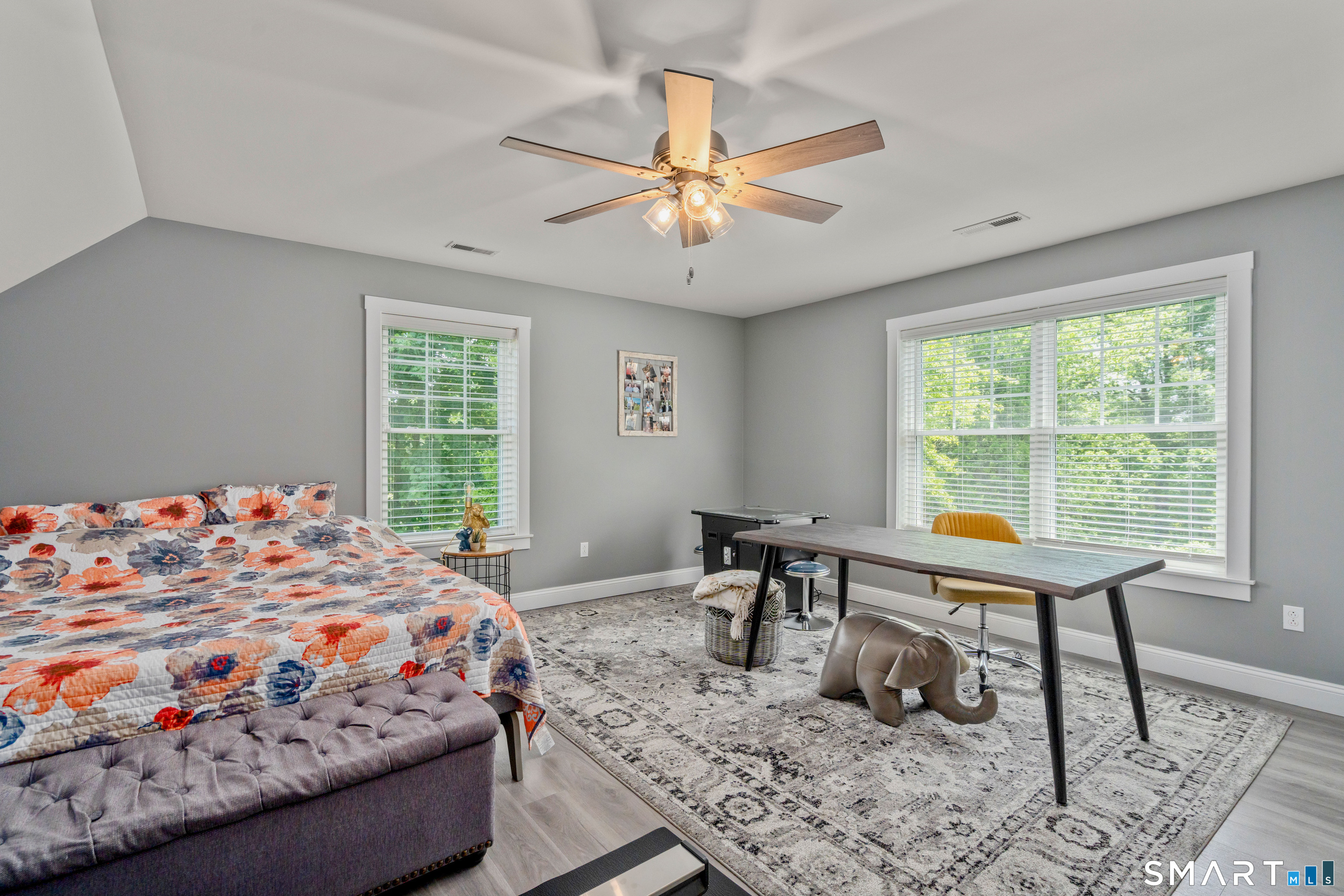 5 Limric Lane Suffield, CT 06078 - Photo 23 of 36 a bedroom with a bed and a table in it