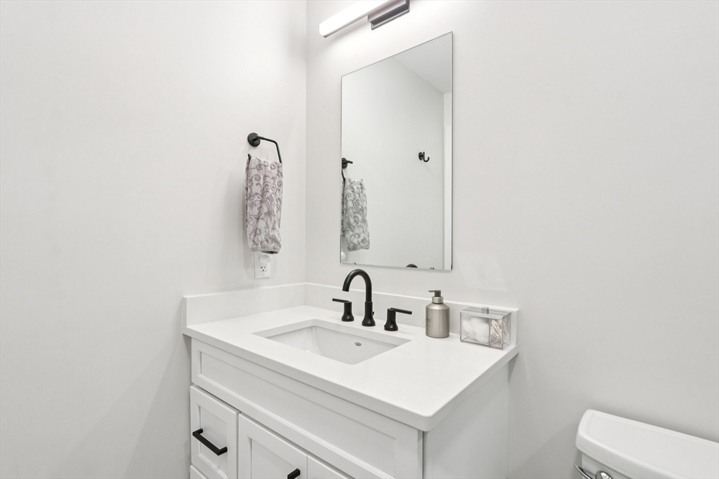 62 Foundry Street, Unit 204 Wakefield, MA 01880 - Photo 17 of 28 a bathroom with a sink and a toilet