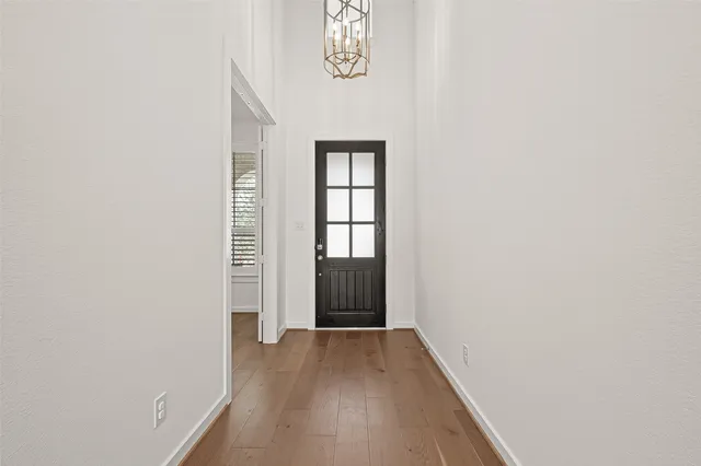 a view of an entryway with wooden floor