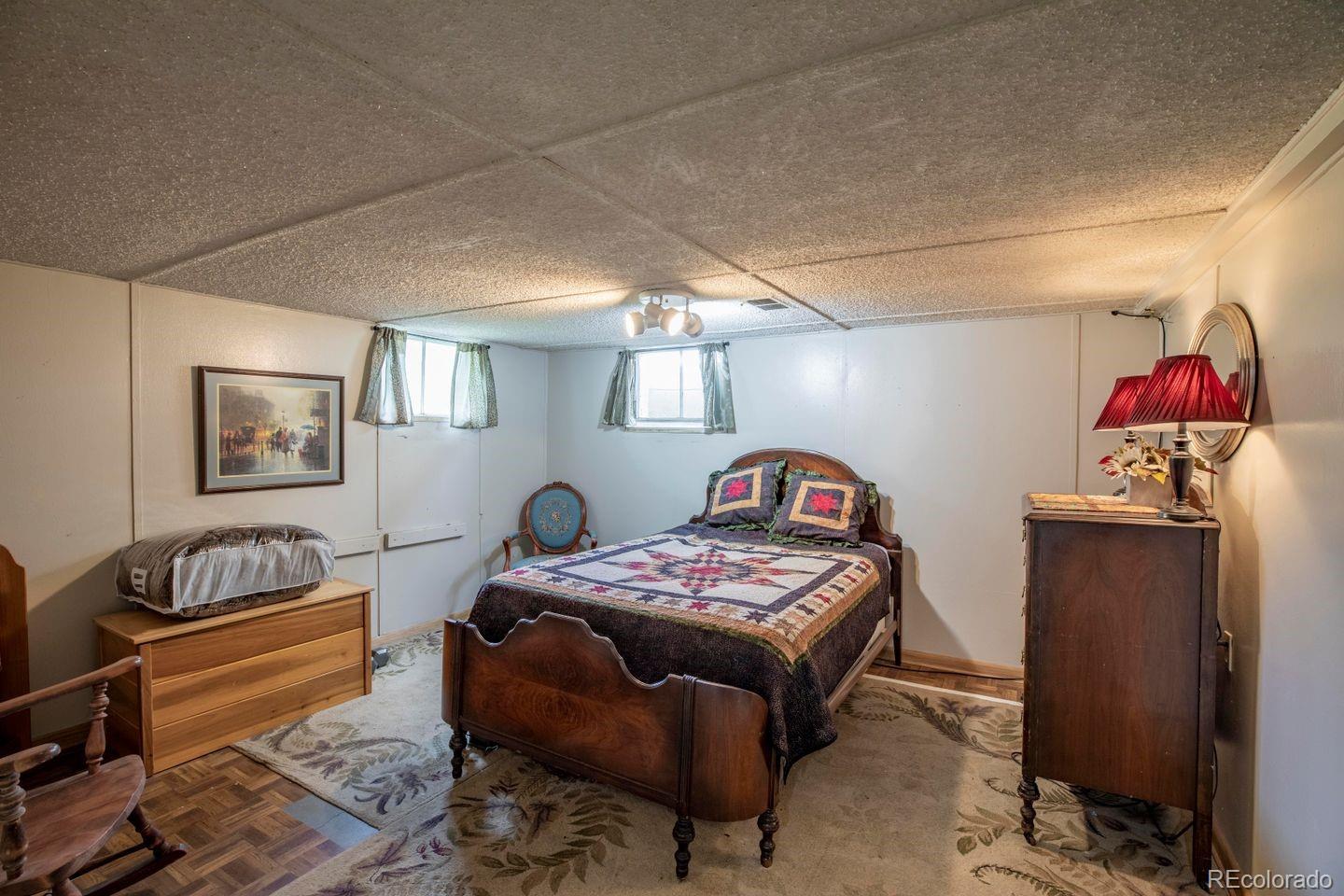 6101 South University Boulevard Centennial, CO 80121 - Photo 36 of 38 a bedroom with furniture and a window