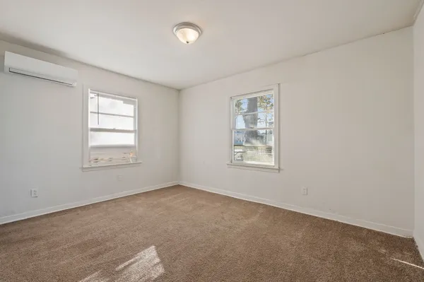 an empty room with windows