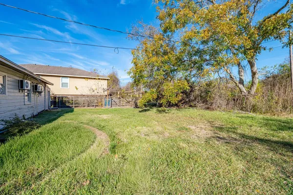 a view of yard with swimming pool