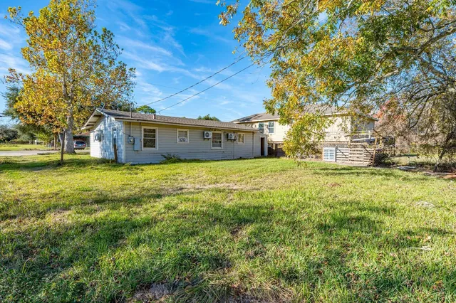 a view of a house with a big yard