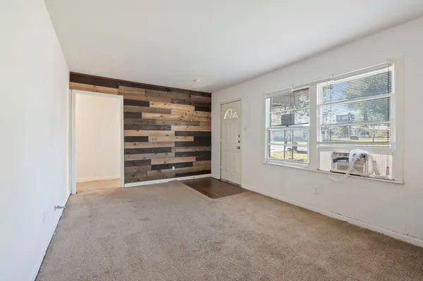 a view of an empty room with a window
