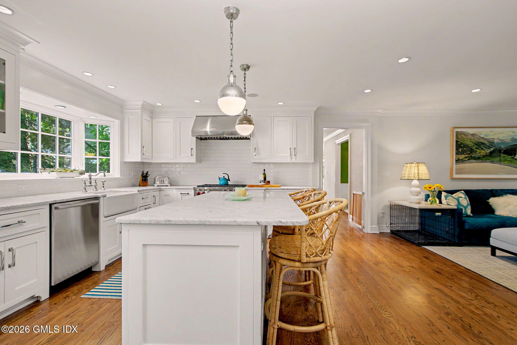 10 Newton Street Riverside, CT 06878 - Photo 13 of 28 a kitchen that has a lot of cabinets in it with stainless steel appliances granite countertop a stove a sink a refrigerator and white cabinets with wooden floor