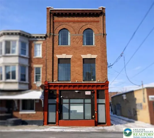 a front view of a building with glass windows