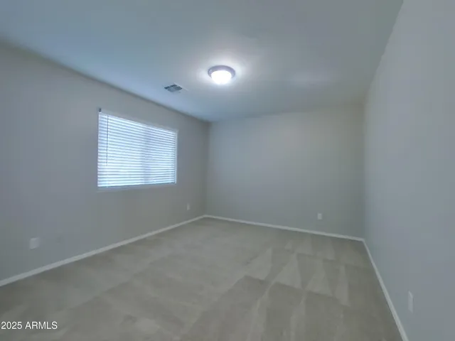 a bathroom with a tub a sink and mirror