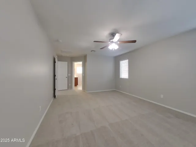 a kitchen with stainless steel appliances granite countertop a sink wooden cabinets and a granite counter tops