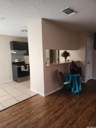 a view of kitchen with furniture and wooden floor