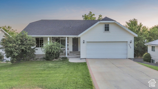 2172 Dakota Avenue Provo, UT 84606 - Photo 1 of 1 View of front of home with a front yard, concrete driveway, a garage, and roof with shingles