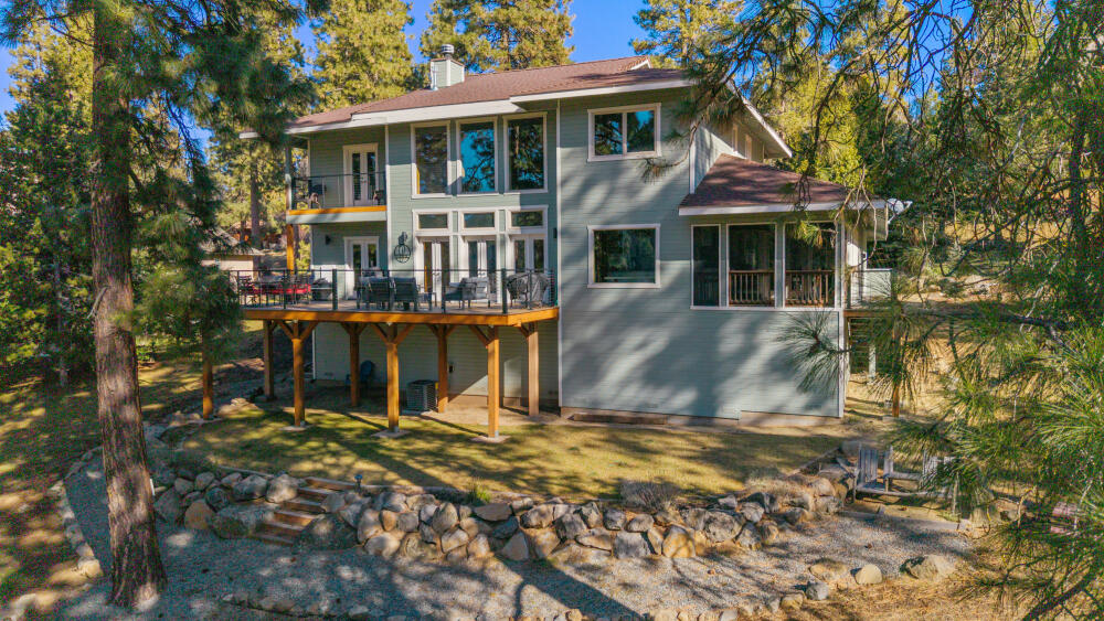 11750 Merganser Road Klamath Falls, OR 97601 - Photo 54 of 66 a view of a house with backyard porch and sitting area