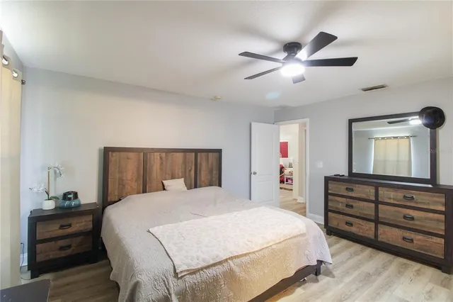 a bedroom with a bed and a dresser