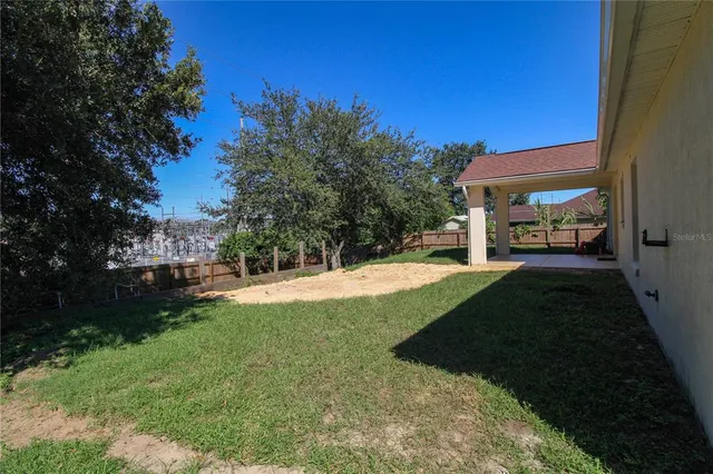 a view of a back yard of the house