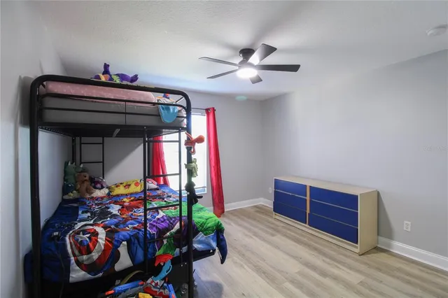 a bedroom with furniture and a chandelier
