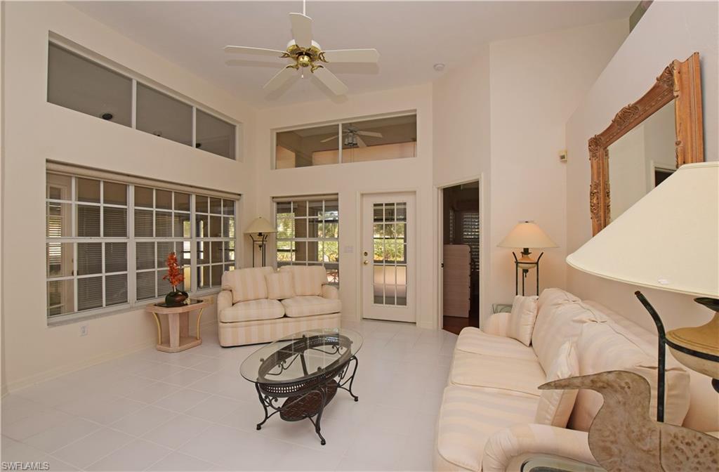 107 Napa Ridge Way Naples, FL 34119 - Photo 3 of 26 a living room with furniture