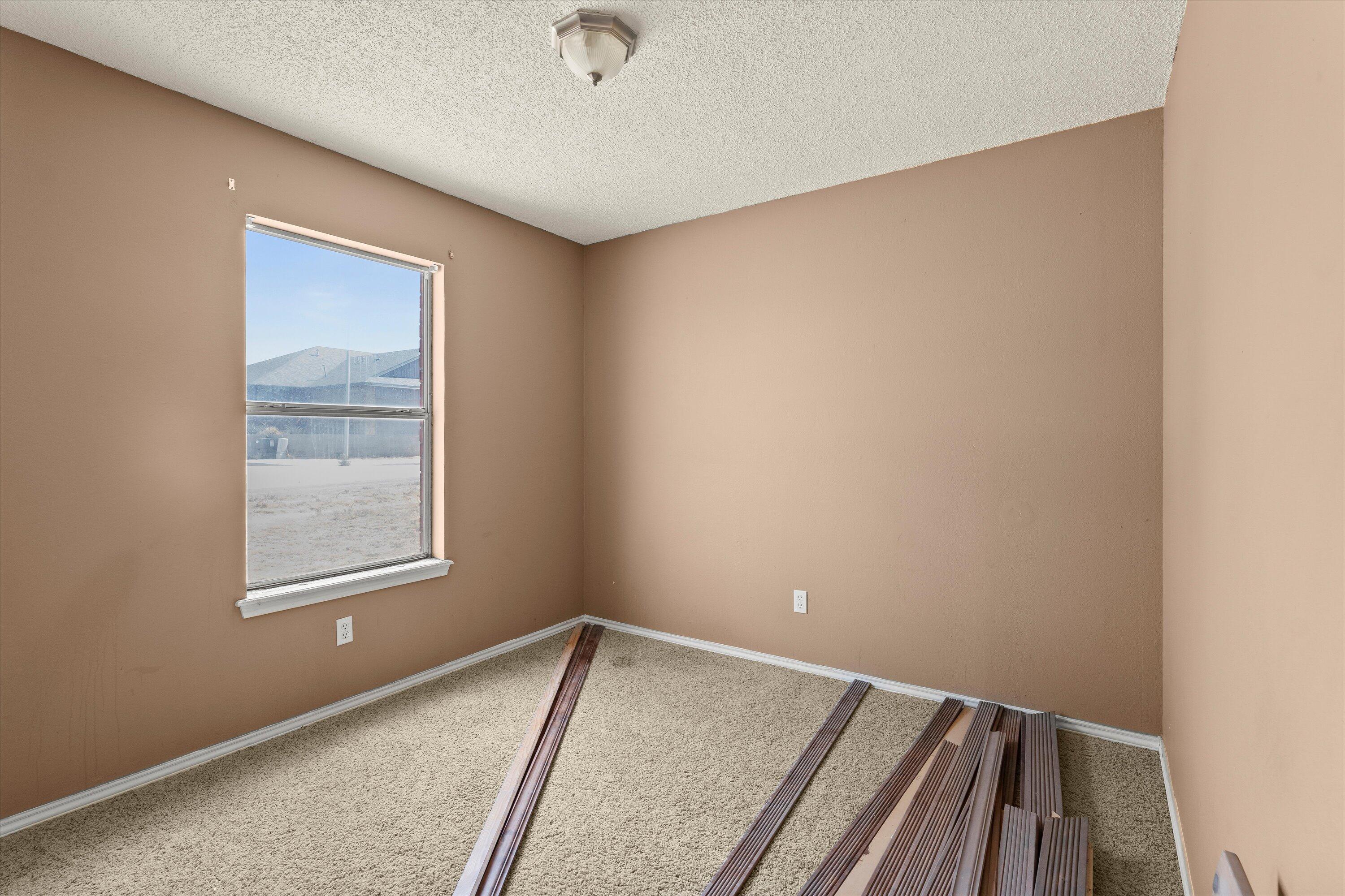 1605 Corpus Avenue Wolfforth, TX 79382 - Photo 15 of 20 an empty room with windows