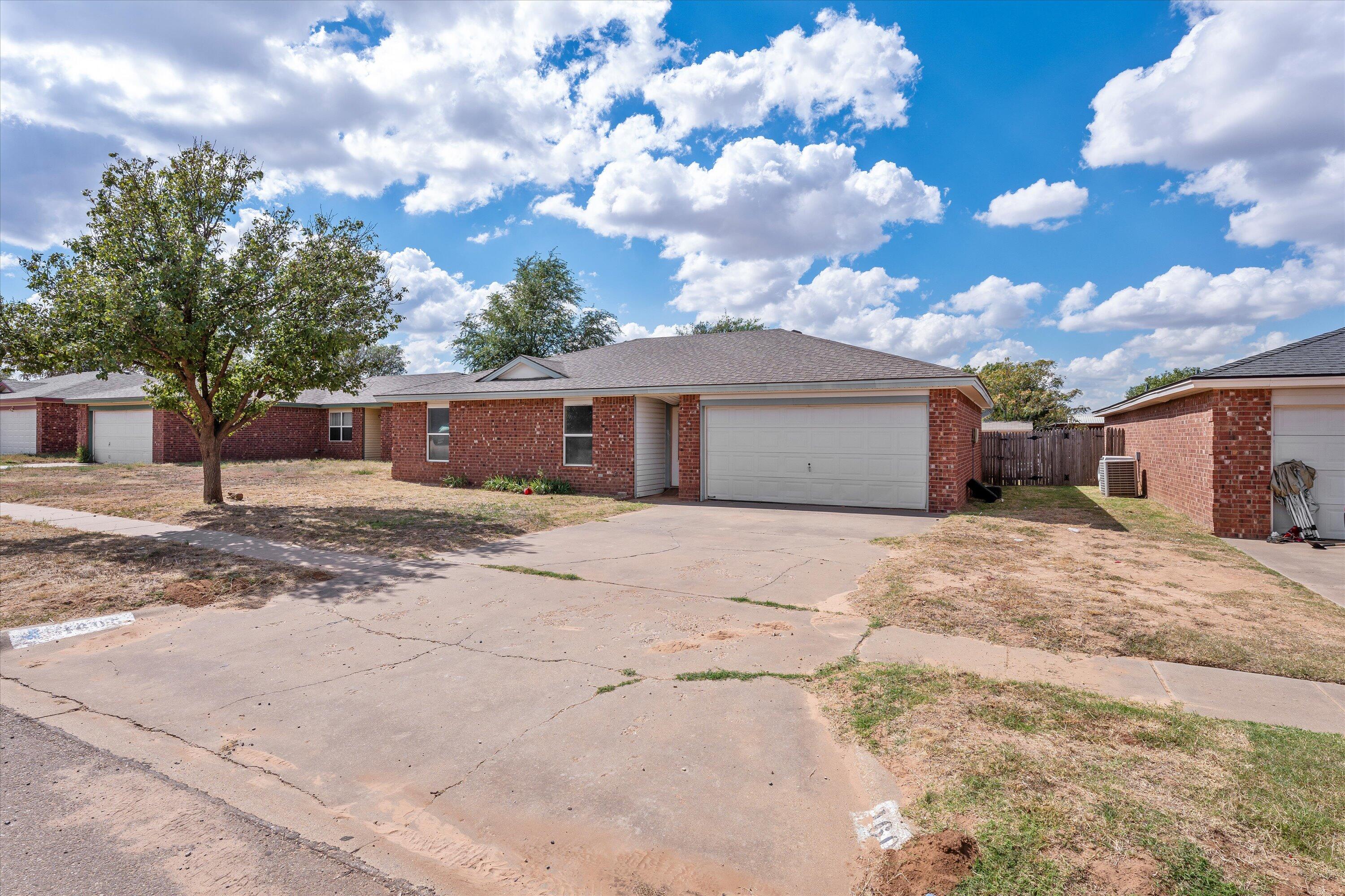 1605 Corpus Avenue Wolfforth, TX 79382 - Photo 2 of 20 a view of a house with a yard