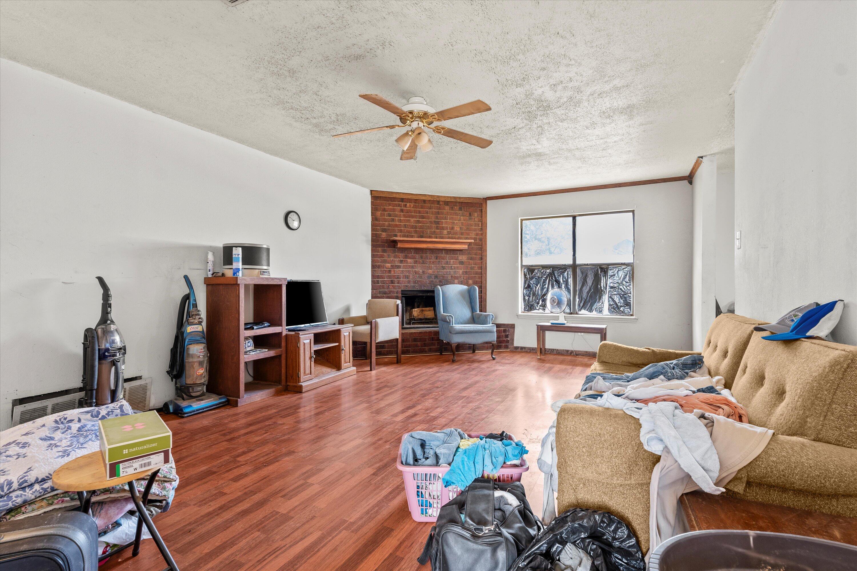 1605 Corpus Avenue Wolfforth, TX 79382 - Photo 4 of 20 a living room with furniture and wooden floor