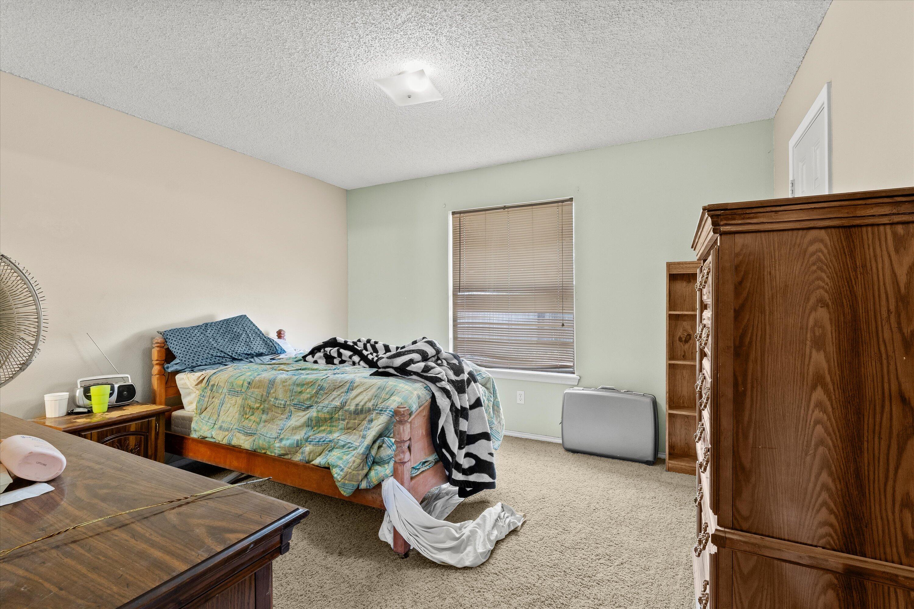 1605 Corpus Avenue Wolfforth, TX 79382 - Photo 9 of 20 a room with furniture and a window