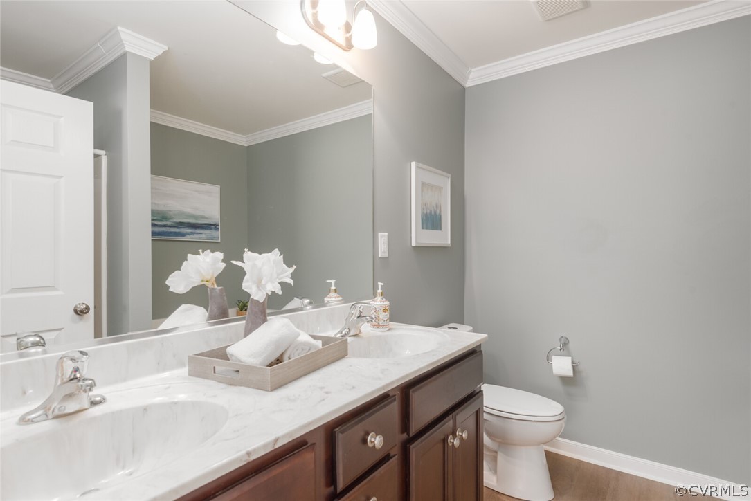 2070 Genito Road Moseley, VA 23120 - Photo 13 of 44 a bathroom with a granite countertop sink and a toilet